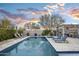 Relaxing pool area with lounge chairs and mountain views at 18391 N 97Th Pl, Scottsdale, AZ 85255