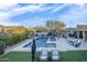 Expansive backyard with a refreshing pool, spa, and outdoor kitchen at 18391 N 97Th Pl, Scottsdale, AZ 85255