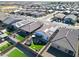 Aerial view showing house, backyard with turf and trampoline, and surrounding neighborhood at 19420 W Highland Ave, Litchfield Park, AZ 85340