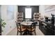 Small dining area with dark wood table and black chairs at 19420 W Highland Ave, Litchfield Park, AZ 85340