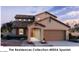 Two-story home with Spanish-style architecture, featuring a two-car garage and landscaping at 20588 N 226Th Ln, Surprise, AZ 85387