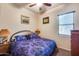 Spacious bedroom with a king-size bed and elegant decor at 2611 W Trapanotto Rd, Phoenix, AZ 85086