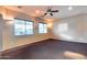 Bright living room featuring ample space, neutral tones, and large windows offering great natural light at 2611 W Trapanotto Rd, Phoenix, AZ 85086