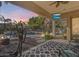 Covered patio overlooks the pool and backyard oasis at 2611 W Trapanotto Rd, Phoenix, AZ 85086