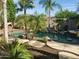 Tranquil pool area featuring rock waterfall, lush landscaping, and plenty of space for outdoor enjoyment at 2611 W Trapanotto Rd, Phoenix, AZ 85086