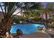 Stunning pool and spa with rock features and lighting at 2611 W Trapanotto Rd, Phoenix, AZ 85086