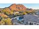 Luxury home with a pool and mountain backdrop at 26475 N 106Th Way, Scottsdale, AZ 85255