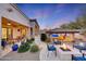 Landscaped backyard with fire pit and seating area at 26475 N 106Th Way, Scottsdale, AZ 85255