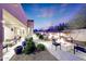 Relaxing patio with fire pit, seating, and lush landscaping at 26475 N 106Th Way, Scottsdale, AZ 85255