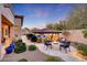 Landscaped backyard with fire pit and pool views at 26475 N 106Th Way, Scottsdale, AZ 85255