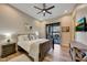 Comfortable guest bedroom with patio access and ceiling fan at 26475 N 106Th Way, Scottsdale, AZ 85255