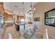 Bright breakfast nook with glass table and chairs, offering pool views at 26475 N 106Th Way, Scottsdale, AZ 85255