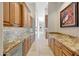Butlers pantry features granite countertops and wine cooler at 26475 N 106Th Way, Scottsdale, AZ 85255