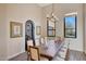Bright dining room featuring a wood table and access to the outdoors at 26475 N 106Th Way, Scottsdale, AZ 85255