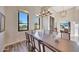 Elegant dining room with a large wooden table and chandelier at 26475 N 106Th Way, Scottsdale, AZ 85255