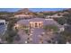 Stunning desert home with a tile roof, stone accents, and a landscaped yard at 26475 N 106Th Way, Scottsdale, AZ 85255