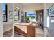 Bright home office features built-in shelving and large windows at 26475 N 106Th Way, Scottsdale, AZ 85255