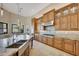 Gourmet kitchen with granite countertops, stainless steel appliances, and custom cabinetry at 26475 N 106Th Way, Scottsdale, AZ 85255