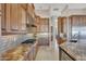 Modern kitchen with granite countertops and high-end Thermador appliances at 26475 N 106Th Way, Scottsdale, AZ 85255