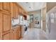 Laundry room with wooden cabinets, washer, dryer, and granite countertop at 26475 N 106Th Way, Scottsdale, AZ 85255