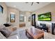 Relaxing living room with large TV and comfortable seating at 26475 N 106Th Way, Scottsdale, AZ 85255
