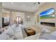 Spacious living room with fireplace, large TV, and comfortable seating at 26475 N 106Th Way, Scottsdale, AZ 85255