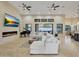 Open living area showcasing a grand piano and access to backyard at 26475 N 106Th Way, Scottsdale, AZ 85255