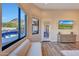 Main bedroom with stunning pool and mountain views at 26475 N 106Th Way, Scottsdale, AZ 85255