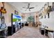Music room with guitars, amplifiers, and a large TV at 26475 N 106Th Way, Scottsdale, AZ 85255