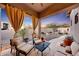 Relaxing patio features comfortable seating and sunset views at 26475 N 106Th Way, Scottsdale, AZ 85255