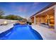 Inviting pool with waterfall feature and mountain views at 26475 N 106Th Way, Scottsdale, AZ 85255