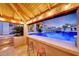 Stunning pool and spa with a covered bar and seating area at 26475 N 106Th Way, Scottsdale, AZ 85255