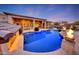 Luxury backyard oasis featuring a large pool, fire pit, and patio area at 26475 N 106Th Way, Scottsdale, AZ 85255