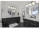 Modern bathroom with double vanity, hexagon tile, and large mirrors at 3022 W Trapanotto Rd, Phoenix, AZ 85086