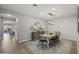 Dining area with a farmhouse table, gray buffet, and wood floors at 3022 W Trapanotto Rd, Phoenix, AZ 85086