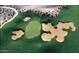 Aerial view of a golf course with green fairways and sand traps at 3172 S Mulberry Ct, Gold Canyon, AZ 85118