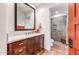 Bathroom with a walk-in shower, dark wood vanity, and terracotta tile floors at 3172 S Mulberry Ct, Gold Canyon, AZ 85118