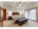 Bedroom with king bed, and access to patio at 3172 S Mulberry Ct, Gold Canyon, AZ 85118
