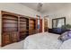 Bedroom with built-in shelving and a comfortable bed at 3172 S Mulberry Ct, Gold Canyon, AZ 85118