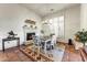 Cozy dining area features a fireplace, chandelier, and rustic decor at 3172 S Mulberry Ct, Gold Canyon, AZ 85118