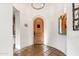 Interior entryway with terracotta tile floor and wood door at 3172 S Mulberry Ct, Gold Canyon, AZ 85118