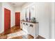 Bright entryway with a red door and a stylish console table at 3172 S Mulberry Ct, Gold Canyon, AZ 85118
