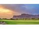 Golf course view with mountain backdrop at sunset at 3172 S Mulberry Ct, Gold Canyon, AZ 85118