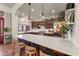 Spacious kitchen with island, stainless steel appliances, and dark wood cabinets at 3172 S Mulberry Ct, Gold Canyon, AZ 85118