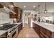 View of a large kitchen with stainless steel appliances and dark wood cabinets at 3172 S Mulberry Ct, Gold Canyon, AZ 85118
