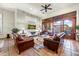 Spacious living room with leather sofas and access to a patio at 3172 S Mulberry Ct, Gold Canyon, AZ 85118