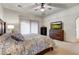 Main bedroom with king bed, TV, and ample dresser storage at 3172 S Mulberry Ct, Gold Canyon, AZ 85118