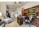 Spacious home office with a large desk and built-in entertainment center at 3172 S Mulberry Ct, Gold Canyon, AZ 85118