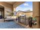 Outdoor patio with built-in grill, seating area, and decorative plants at 3172 S Mulberry Ct, Gold Canyon, AZ 85118