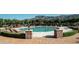 Resort-style pool with lounge chairs and mountain views at 3172 S Mulberry Ct, Gold Canyon, AZ 85118